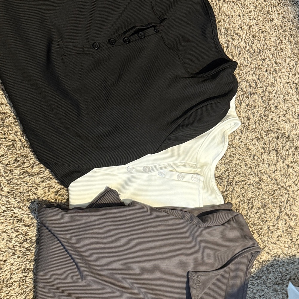 Black, White, and Gray Button-Up Shirts